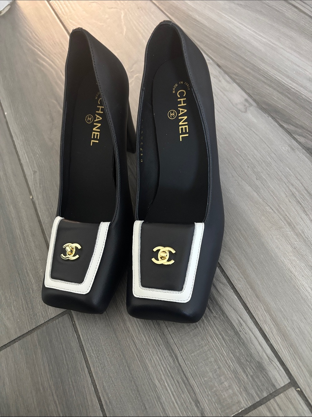 CHANEL Black and White Square-Toe Heeled Pumps with Gold CC Accents